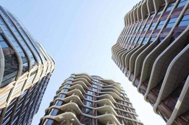 Looking up at the sculpted facades of the three Triptych Bankside towers