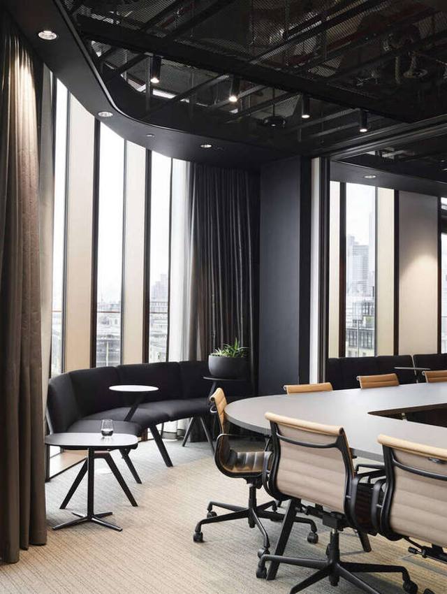 Boardroom with curved banquette seating and city views