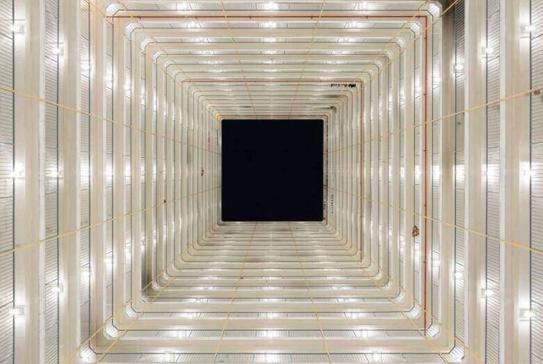 Lightwell Studies No.1, a photograph looking up a lit atrium by Serge Horta