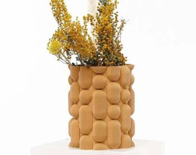 Sisi vase by Sheyn, 3D-printed in a warm sand tone, holding dried mimosa